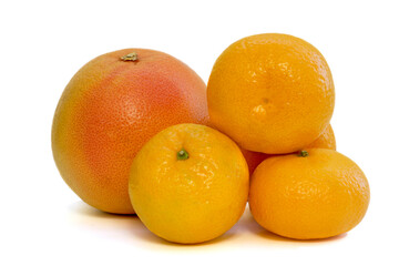  ripe tangerines and grapefruit on a white background