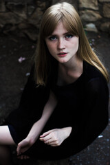 Naklejka premium portrait of a young woman in black dress