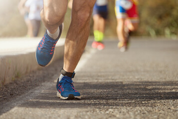 Fototapeta na wymiar Marathon running race, runners feet on road, sport, fitness and healthy lifestyle concept