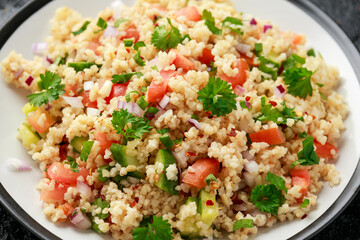Tabbouleh salad with tomato, cucumber, red onion, bulgur and parsley. Healthy vegan food