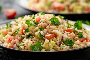 Tabbouleh salad with tomato, cucumber, red onion, bulgur and parsley. Healthy vegan food