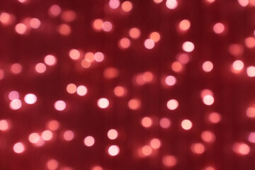 defocused picture of bokeh for christmas and new year celebration on red background