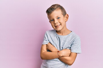 Fototapeta premium Adorable caucasian kid wearing casual clothes happy face smiling with crossed arms looking at the camera. positive person.