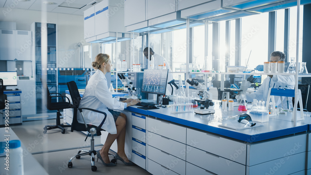 Wall mural medical science laboratory with diverse team of professional scientists working with microscopes, co