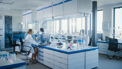Bright High-Tech Medical Science Laboratory with Diverse Team of Professional Research Scientists...