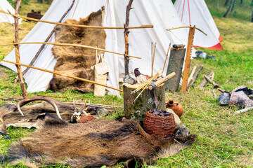 Bowyer, master craftsman, workshop with arrows, bows and crossbows in historical reenactment of...