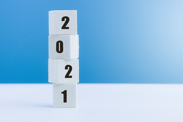 Vertical wooden cube with number 2021, start up for New Year 2021, Happy New Year changing year.
