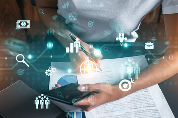 Business analysis hologram and a woman signing contract use phone. Double exposure.