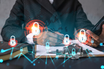 Businesswoman taking notes using smart-phone. Lock icons hologram double exposure. Security concept.