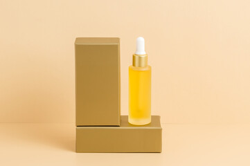 Yellow dropper bottle of serum or oil standing on golden podium with neutral beige background. Organic skin care cosmetics with vitamin C, wellness, spa and beauty treatment concept, product mockup