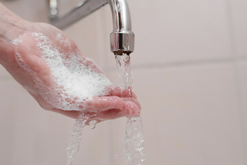 Hygiene. Cleaning Hands. Washing hands on sink.