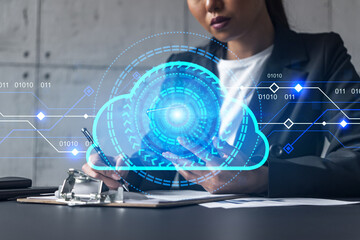 Businesswoman taking notes and cloud storage hologram. Double exposure. Business technology solution.