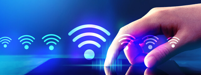 Wifi theme with hand pressing tablet computer screen