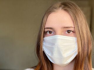 Portrait young caucasian female wearing medical mask coronavirus 