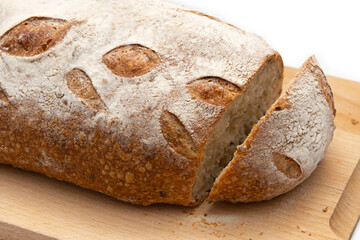rye bread on a wooden board on a white background