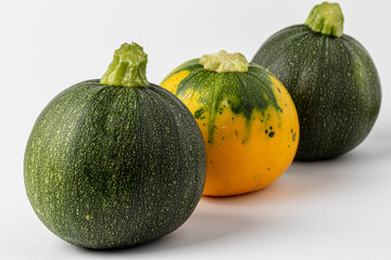 green and yellow zucchini isolated on white background