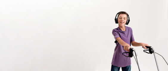 Portrait of happy teenaged disabled boy with cerebral palsy in headphones listening to music,...