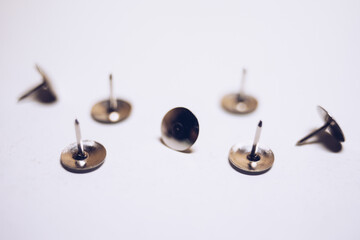 stationery nails on a white table