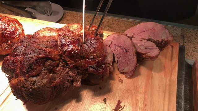 Carving Beef On Woodrn Station In Restaurant