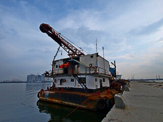 "
Large ships loading crain back at the port of the North Jakarta area with calm seas"
