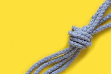 Rope knot. Concept for trust, faith, strength or stress. Selective focus. Trend color of the year 2021