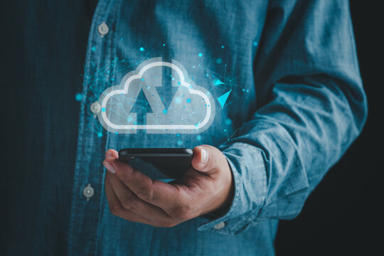 Man holding smart phone with virtual cloud computing on hand with connection line.Cloud computing is system for sharing download and upload big data information.