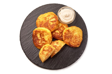 Potato pancakes with sour cream, isolated on white background