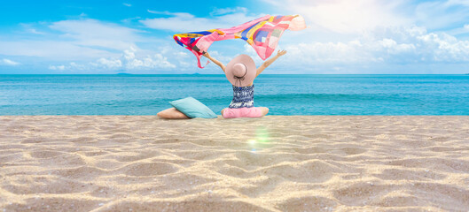Beautiful Girl in sea style sitting on the beach. Travel and Vacation. Freedom Concept,Panorama sea view in summer time.