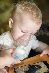 Inhalation makes child at home. Treatment of disspirators diseases with nebulizer with medication.