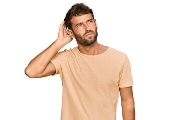Handsome young man with beard wearing casual tshirt confuse and wondering about question. uncertain...