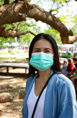 Virus mask Asian woman travel wearing face protection in prevention for coronavirus in Thailand.