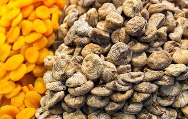 Bunch of dried figs and dried apricots on street market