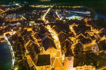 aerial view  of a medieval tow with christmas lights 