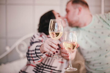 a girl and a guy drink champagne