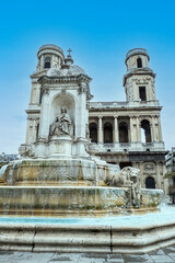 Fototapeta na wymiar The church of Saint Sulpice in Paris with a beautiful fountain