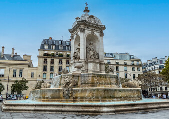 Fototapeta na wymiar The church of Saint Sulpice in Paris with a beautiful fountain