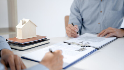 Fototapeta premium Real estate agent give a financial advice to customer about house debt..