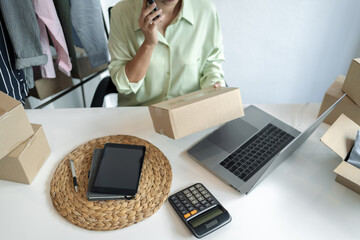 Business owner entrepreneur packing cardboard box preparing parcel for shipment, Online marketing..