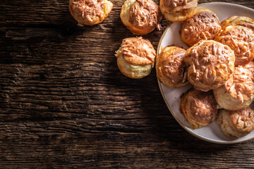 Top view of crispy hot bread buns called pogaca on a rustic wood