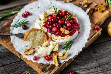 Baked Camembert brie with fresh rosemary and cranberry sauce. Gourmet appetizer. Breakfast, Food...