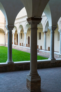 Arches And Green Lawn Of Old Franciscan Friars Cloister. Ravenna, Italy