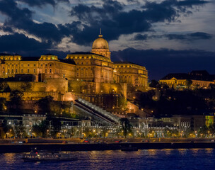 Fototapeta na wymiar View of Royal Castle Budapest, with the Royal Gardens, Castle Garden Bazaar and the Danube river at night