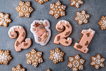 Happy New Year's set of numbers 2021. Ox-shaped cookies, symbol of the Chinese horoscope. Christmas homemade gingerbread cookies.