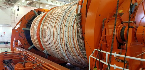 cable laying with a tensioning machine