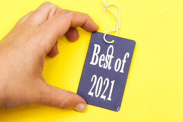 closeup hand holding tag with best of 2021
