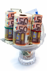 Monetary denominations laid in a vase,white backgrou