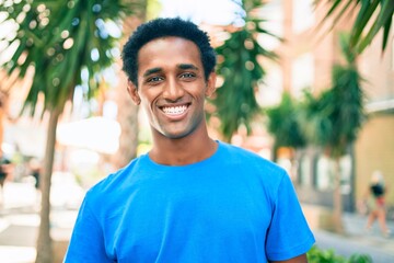 Handsome black african man smiling happy outdoors