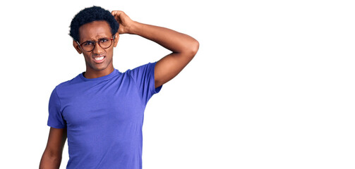 African handsome man wearing casual clothes and glasses confuse and wonder about question....