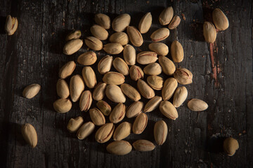 Pistachio on a dark wooden background