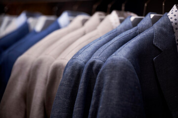 Obraz premium men clothing on hanger in a shop - shopping in mall concept